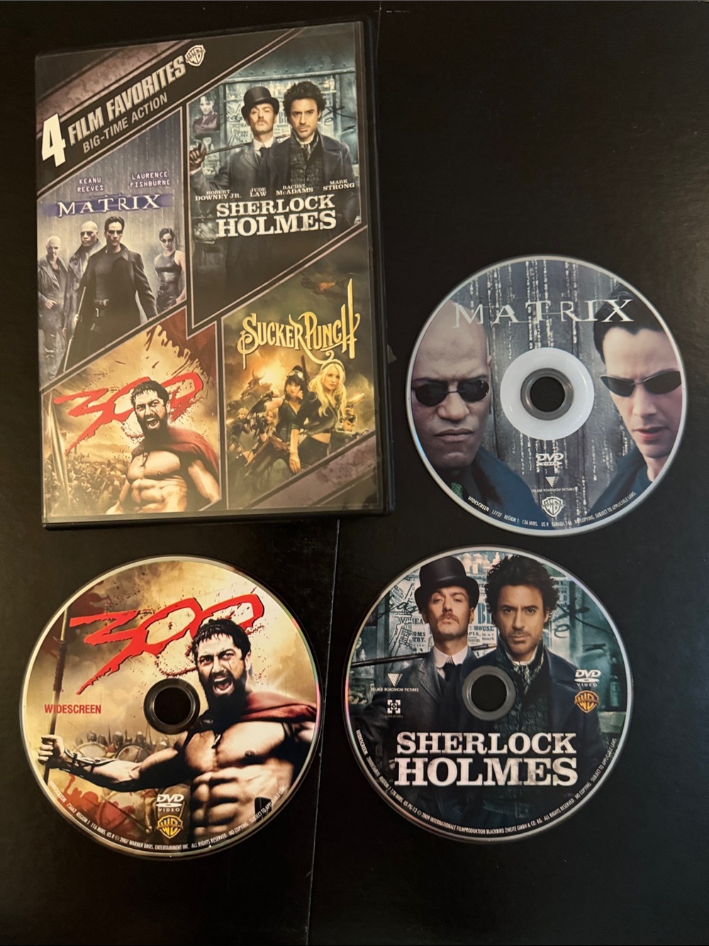 4 film favorites DVD’s 📀 in one case. 300, The Matrix, Sherlock Holmes, ~ plus _